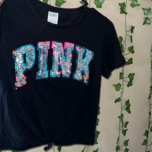 Im selling this cute small pink t-shirt sort of cropped but not really